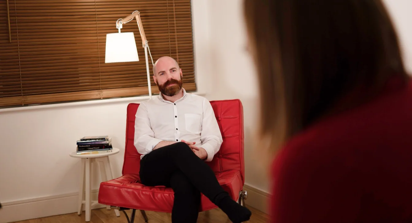 James McWilliams listening during a therapy session.